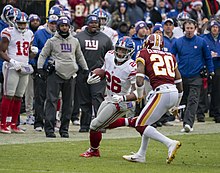 Clinton-Dix (right) with the Redskins in 2018 Saquon Barkley (46250993361).jpg
