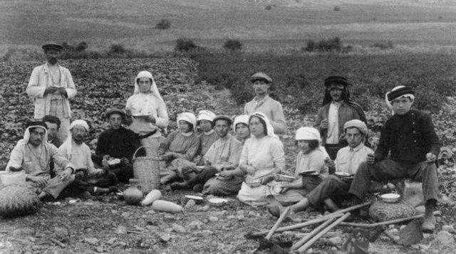 Second Aliyah workers eating lunch in the fields of Kibbutz Migdal, 1912