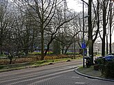 Square Frederiksplein in Amsterdam city with in the background the building constructions of the Central Dutch Bank; free photo, Fons Heijnsbroek, January 2022