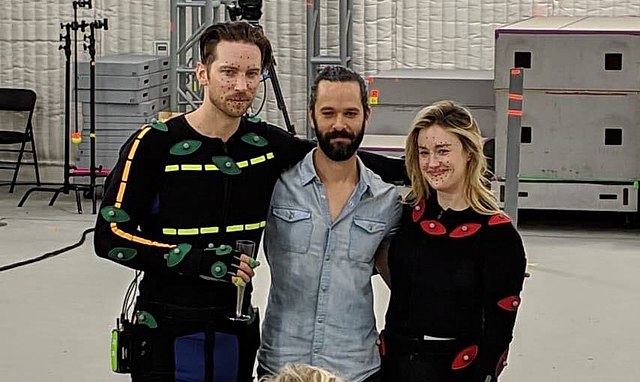 Druckmann (center) on the final day of motion capture production of The Last of Us Part II with Troy Baker (left) and Ashley Johnson (right)