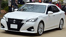 A fourteenth generation Crown with its rotating lights in its ascended position Toyota Crown GRS214 Unmarked car.jpg