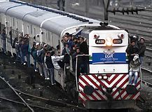 Train Surfing on a diesel locomotive and passenger coaches at Roca Line, Buenos Aires