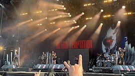 Within Temptation performing at the Download Festival in 2023. Between 2020 and 2023, all stand-alone singles that later were made part of the album were performed live. Within Temptation - Download Festival 2023.jpg