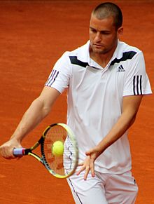 Youzhny hitting one of his one-handed backhands at the 2014 Mutua Madrid Open. Youzhny MA14 (8) (14424468632).jpg