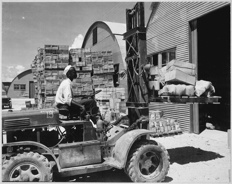 File:"M. D. Shore, S1-c, operating a forklift truck at the Navy supply depot at Guam, Marianas.", 06-08-1945 - NARA - 520685.tif