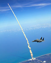 Atlantis heads into space while a pair of F-15E Strike Eagle jets patrols the skies over Kennedy Space Center. 4th FW Strike Eagles assist shuttle launch.jpg