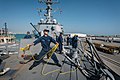 A Sailor throws a heaving line in Bahrain. (8580535276).jpg