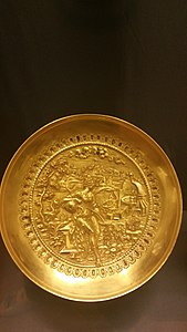 Day 10:Golden plates depicting women warriors.