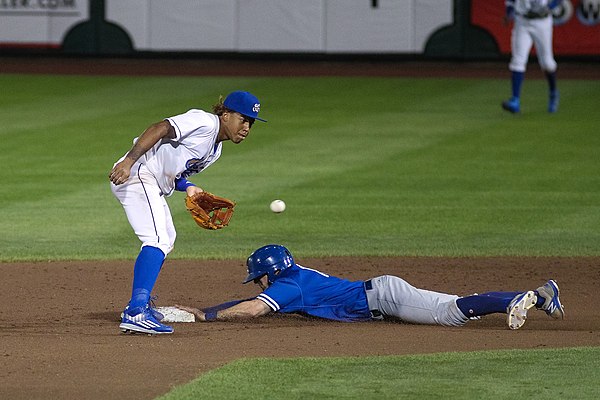 Tim Locastro steals second base for the Oklahoma City Dodgers during a 2017 game