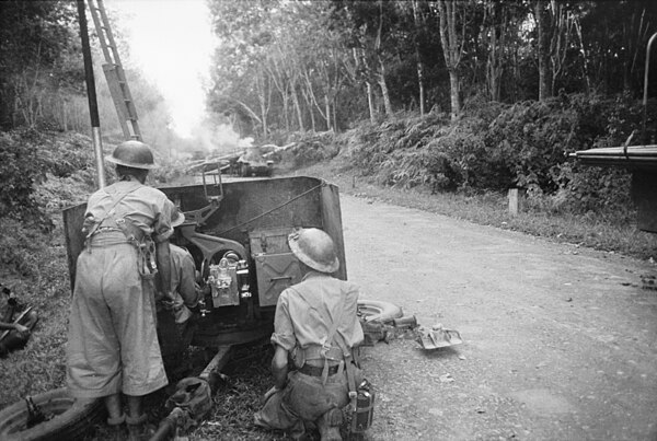 Australian 2 pounder gun of 13th Battery, 2/4th Anti-Tank Regiment, firing on Japanese Type 95 Ha-Go light tanks of the 14th Tank Regiment on the Muar