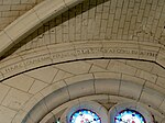 Inscription sur le l'arc formeret au revers de la façade de l'église Saint-Lucien à Avrechy.