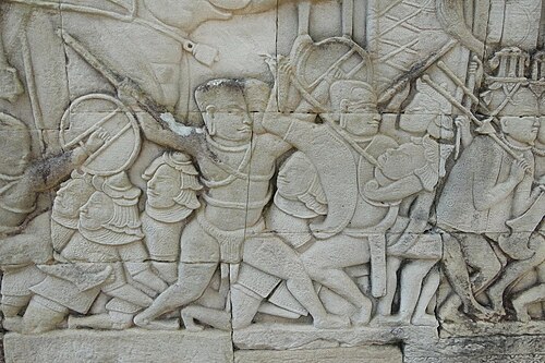 Bas-relief of a headlock at the Bayon temple(12th/13th century).  A  Khmer soldier puts a Cham soldier in a headlock.