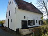 Kraekermolen; watermolen op de Thornerbeek, reeds vermeld in 1310. Huis met zadeldak en houten kozijnen