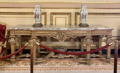 Large console with central projection; by Benjamin Deguil and Benjamin-Paul Ramillon; 1850-1875; gilt wood and marble; 100 x 283 x 77 cm; Napoleon III Apartments, Louvre Palace, Paris[177]