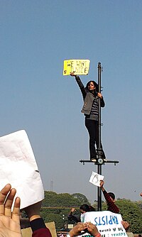 Students protesting at Raisina Hill, Rajpath, December 2012 Delhi protests-Another lamp-post revolutionary.jpg