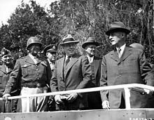 Secretary of War Henry L. Stimson (right) and his advisors review the 2nd Armored Division in Germany in July 1945. Left to right: Major General Floyd L. Parks, General George S. Patton, Jr., Colonel William H. Kyle, John J. McCloy, Harvey H. Bundy Dignitaries review the 2nd Armored Division during the Potsdam Conference.jpg