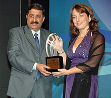 Dr. Lisa Hensley accepts an award at The Outstanding Young Persons of the World ceremony in New Delhi.jpg