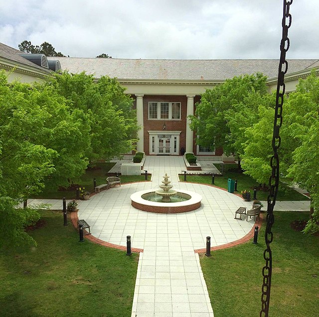 The fountain and courtyard of the Thomas W. and Robin W. Edwards College of Humanities and Fine Arts.