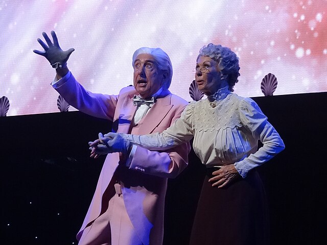 Idle (left) and Carol Cleveland performing the “Galaxy Song” (from Monty Python's The Meaning of Life) at Monty Python Live (Mostly) in 2014