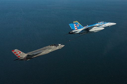 FA-18F Super Hornet of VX-23 refuels F-35C on 26 June 2018 (180626-N-ZB537-071)