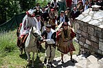 Thumbnail for File:Galichnik wedding - The bride accompanied by the groom's best man " dever" on the way to the church.jpg