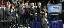 Shortly after his second inauguration, Bush (here seen with a panel in Omaha, Nebraska) toured the nation to promote his proposal for Social Security (United States) personal accounts. George W. Bush Omaha panel (cropped).jpg