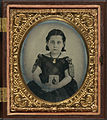 Girl in mourning dress holding framed photograph of her father.jpg