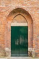 Side entrance in a masonry arch.