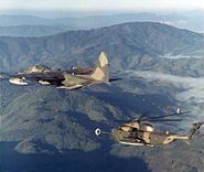 An HH-53B of the 40th ARRS refueling from an HC-130P over North Vietnam, 1969–70.