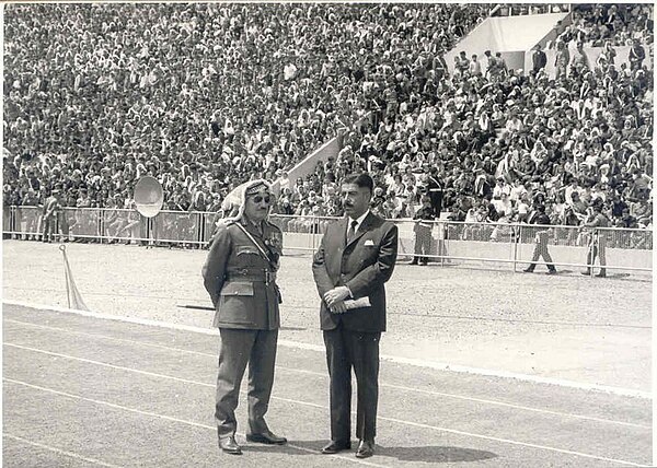 Habis Majali seen with Prime Minister Wasfi Tal during a military parade.