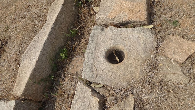 File:Hampi Ruins - Grinding Stone.jpg