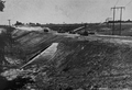 File:Hwy 35 Wilmot Creek grading, 1955.png