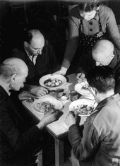 Jews eating at a community soup kitchen, 1943 or earlier Jews eating at a soup kitchen.png