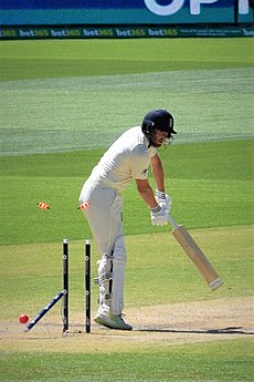 Jonny Bairstow is out bowled. Note the wire from the stump microphone attached to the displaced middle stump. Jonny Bairstow bowled by Mitchell Starc.jpg