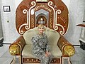 Laura Cabanilla in Saddam Hussein's throne in Iraq.jpg