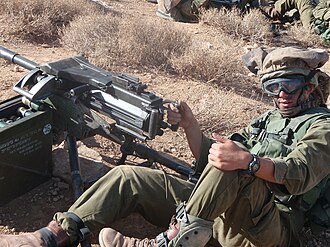 The MK-19 automatic grenade launcher, carried on the backs of IDF infantry soldiers. Maklar (MK-19) Automatic Grenade Launcher.JPG