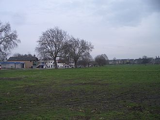 View of Midsummer Common, looking east. Boathouses can be seen on the opposite bank of the River Cam, and houseboats are visible on the river Midsummercommon.jpg