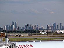 Higher-density development in Mississauga as seen from Pearson Airport in Toronto Mississauga skyline Pearson 2013.jpg