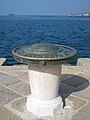 The compass rose at the head of the pier