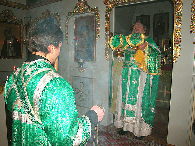 Orthodox subdeacon and priest making the Great Entrance during the Divine Liturgy.
