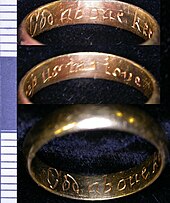 A post-medieval gold posie ring found in Leicestershire, England. Dated between 1600 and 1800, it is inscribed "God above keep us in love." Post medieval gold posy ring (FindID 276914).jpg