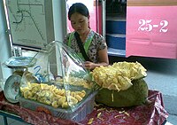 Selling jackfruit in Bangkok.