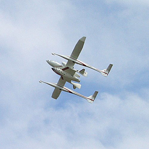 The winning spaceplane SpaceShipOne being carried below its launch vehicle White Knight