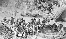 Spotters from the New Guinea Air Warning Wireless Company reading mail at Rouna Falls in Papua in May 1942 Spotters from the New Guinea Air Warning Wireless Company reading mail during May 1942.jpg