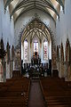 Das Mittelschiff von der Orgelempore aus fotografiert. Im Chor probt der Knabenchor capella vocalis aus Reutlingen. St Martin, Memmingen