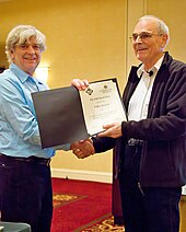 Gary Miller presents Volker Strassen with the 2008 Knuth Prize at SODA 2009 Strassen Knuth Prize presentation.jpg
