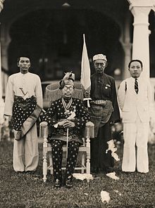 Ahmad Tajuddin, the 27th Sultan of Brunei, with members of his court in April 1941, eight months before the Japanese invaded Brunei Sultan Ahmad Tajuddin (AWM P10841.001).JPG