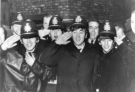 The Beatles outside the Birmingham Hippodrome, November 1963. Because the crowds were so thick, they had to be smuggled into the venue with assistance from local police.[10]