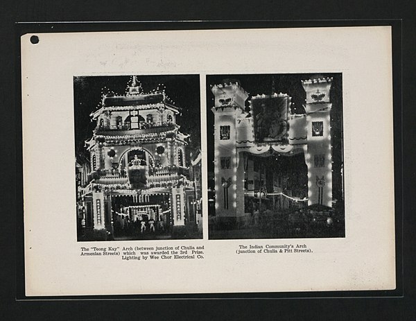 The Indian Community's Arch at the junction of Chulia & Pitt Streets during the night (right), Penang, 1937.