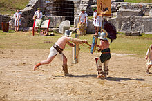 Recreation of a combat between a thraex and murmillo in the Carnuntum Roman ruins. Thraex murmillo show fight 01.jpg